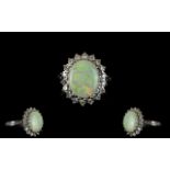 Ladies 18ct White Gold Opal & Diamond Set Cluster Ring appealing flower head design marked 18ct.