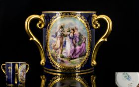 Alexandra Porcelain Works Handpainted 3 Gilt Handle Cup circa 1890.