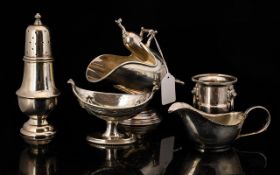 A Small Collection Of Silver Plated Items To Include a cream jug, sugar castor,