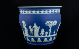 Large Blue & White Porcelain Planter. Decorative planter with white design on blue ground.