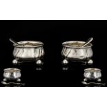 A Pair Of Continental Silver Salts Cauldron Shape With Cannon Ball Feet. With Matching Spoons.