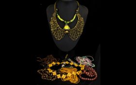 A Collection Of Costume Jewellery Necklaces Nine items in total to include statement seed bead and