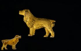 A Silver Gilt Brooch Textured metal bowl in the form of a spaniel dog, pin back fastening,