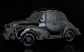 Large Scale Ceramic Model Of Morris Minor Car Black glazed ceramic, 15 inches in length.