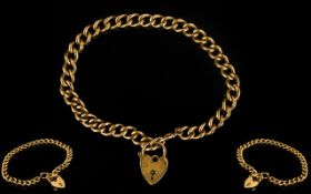 Ladies Good Quality 9ct Gold Curb Bracelet with attached 9ct Gold Heart-Shaped Padlock.