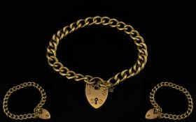 9ct Gold Curb Bracelet with Heart Shaped Padlock and Safety Chain. Fully Hallmarked for 9.375 Gold.