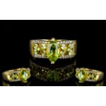 Peridot and White Zircon Band Ring, a 1.