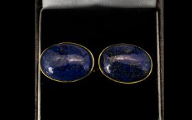 A Pair Of Lapiz Lazuli Cufflinks Oval form gold tone cufflinks, each set with oval lapiz cabouchons,