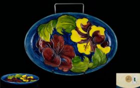 W. Moorcroft Tubelined and Shaped Tray, Hibiscus Design on Blue Ground, Paper Label to Underside