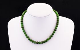 Antique Jadeite Bead Necklace Hand knotted necklace comprising spherical beads with barrel screw