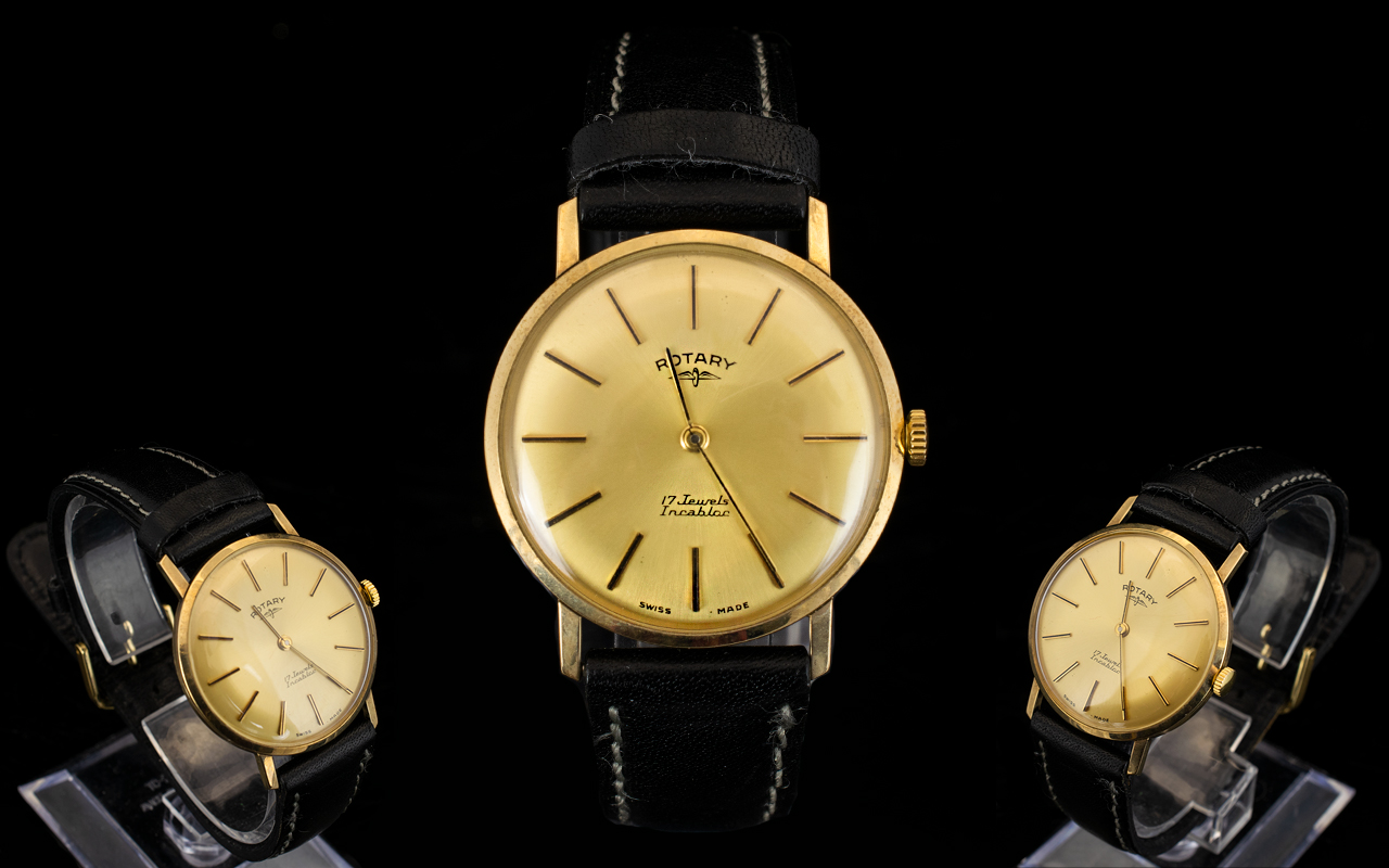 A Gents 9ct Gold Rotary Wristwatch Gilt dial with baton numerals, manual wind, 34 mm 9ct gold case,
