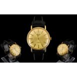 A Gents 9ct Gold Rotary Wristwatch Gilt dial with baton numerals, manual wind, 34 mm 9ct gold case,