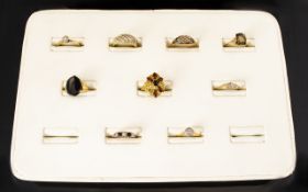 A Collection Of Eight 9ct And One 18ct Gold Dress Rings Various designs and settings to include,