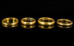 A Small Collection of 22ct Gold Wedding Bands Four (4) in Total. All fully hallmarked for 22ct.