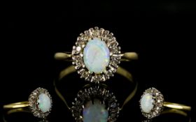 18ct Gold Attractive Opal And Diamond Set Cluster Ring Flowerhead setting with central opal