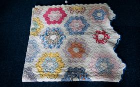 Early 20th Century American Patchwork Quilt Polychrome pieced quilt in hexagonal floral design with