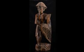 A Carved Wood Figure In The Form Of A Fisherman With Net Hand carved figure depicting Malayan