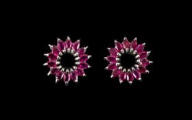 Ruby Marquise Cut Circle Earrings, a flared circle of marquise cut rubies spreading from an open