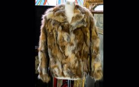 Fox Fur Ladies Short Jacket fully lined in polysatin with floral decoration. With hook and eye