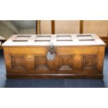Antique Coffer - of panelled form with antique effect padlock, carved panels to front,