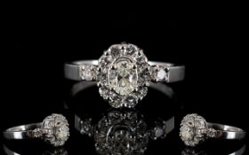 18ct Gold Diamond Set Cluster Ring Set with central oval cut diamond,