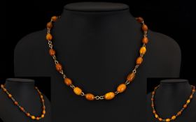 Butterscotch Amber Beaded Wired Necklace Antique necklace comprising 23 oval amber beads of good