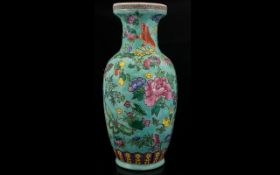 A Modern Chinese Vase Polychrome baluster form vase depicting butterflies amongst blossom and