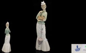 Lladro Handpainted Porcelain Figure 'Walk with the Dog'. Model No. 4893. Issued 1974. Height 14.