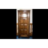 Oak Hall Cupboard - comprising top shelf to interior, panelled front with floral decoration to door.