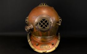 Full Sized Reproduction Brass And Copper Divers Helmet of typical form.