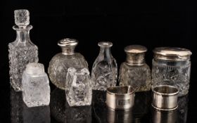 A Collection Of Cut Glass And Silver Topped Vanity Items Seven bottles in total to include small