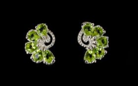 Peridot Fan Shape Stud Earrings, each earring comprising five pear cut peridots,