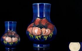 Moorcroft Tube lined Small Vase ' Clematis ' Pattern on Blue Ground. 4.25 Inches - 10.75 cm High.