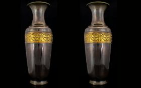 A Pair Of Mixed Metal Vases Of neoclassical design with swag and scroll borders. Each drilled and