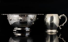 Two Pieces Of Silver Plated Ware To include twin handle quaich raised on four scroll feet,