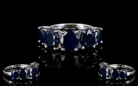 Sapphire Five Stone Band Ring, five oval cut sapphires, graduating down, either side of the centre