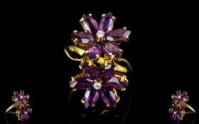 18ct Gold - Double Flower head Designed Amethyst and Diamond Dress Ring From The 1970's Period.