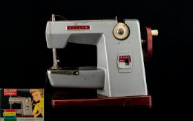 Vulcan Child's Electric Sewing Machine in Original Box. Includes extension work table clamp and