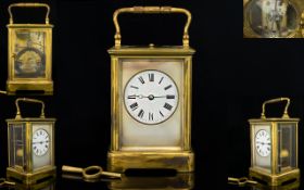 French Repeating Carriage Clock Of typical form with brass lacquered case,