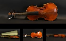 A Late 19th Early 20th Century Violin Two piece back, along with bow and fitted case,