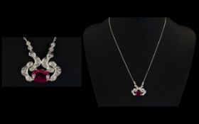 18ct White Gold Ruby And Diamond Pendant Set with large central ruby surrounded by round cut