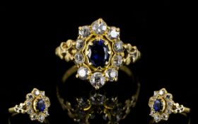 18ct Gold Sapphire And Diamond Cluster Ring The central blue sapphire surrounded by round cut