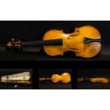 A Late 19th Early 20th Century Violin Two piece back, along with bow and fitted case,