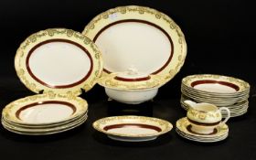 A Midwinter Part Dinner Service White ground with Bordeaux trim and wide cream fluted rim with gilt