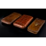 Three Leather Cigar Cases Each in good condition, comprising Mock reptile slip cover case,