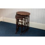 A Nest Of Four Walnut Tables Circa early 20th century with inlaid work to oval top,