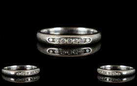 Platinum And Diamond Eternity Ring Channel set with seven round modern brilliant cut diamonds,