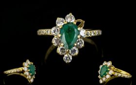 18ct Gold Emerald And Diamond Cluster Ring Pear shaped emerald surrounded by 10 round brilliant