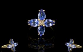 9ct Gold Tanzanite And Diamond Ring Central diamonds surrounded four pear cut tanzanites.