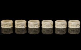 Late 19th Century Ivory Napkin Rings Decorated With Marching Elephants. Six In Total.